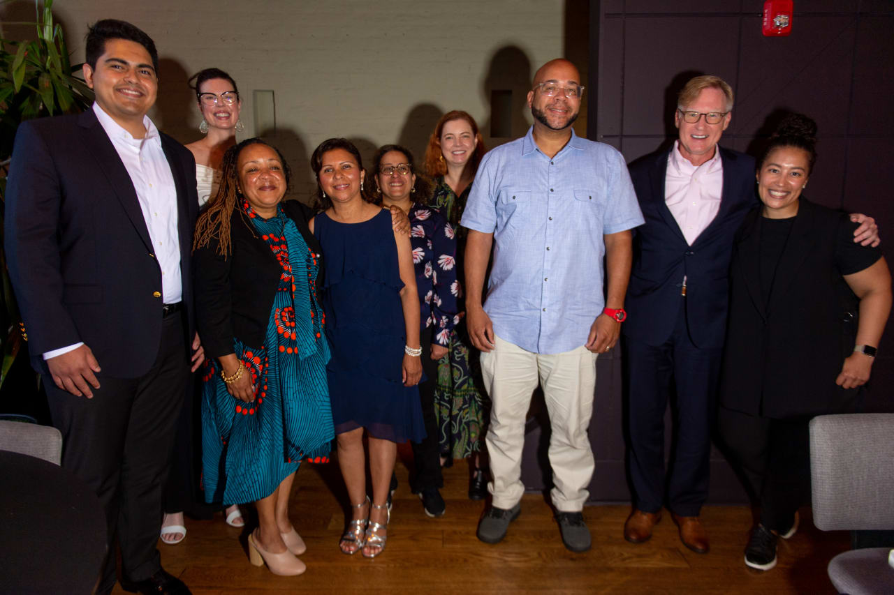 Front Row (L to R): Hiram Cortez, Regine Elie, Ana Quijada, Mazi Mutafa, Jeffrey Johnson, Shanell Mosley Second Row (L to R): Christine Steffens, Karen George, Donna Adams